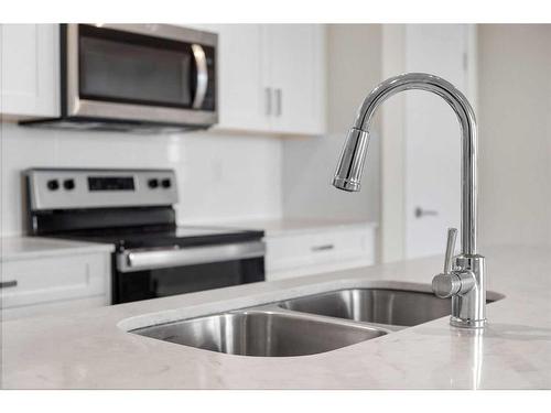 408-35 Walgrove Se, Calgary, AB - Indoor Photo Showing Kitchen With Double Sink