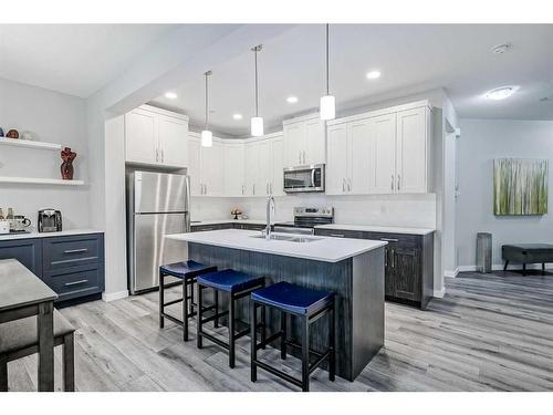 217 Lucas Crescent Nw, Calgary, AB - Indoor Photo Showing Kitchen With Stainless Steel Kitchen With Double Sink With Upgraded Kitchen