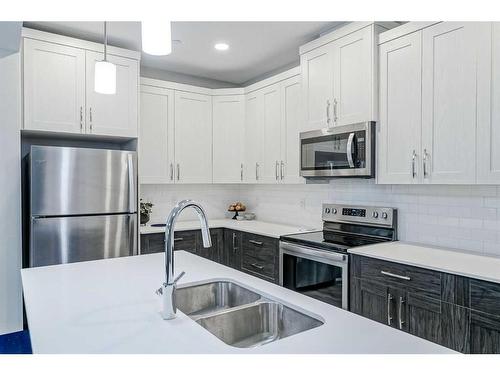 217 Lucas Crescent Nw, Calgary, AB - Indoor Photo Showing Kitchen With Stainless Steel Kitchen With Double Sink With Upgraded Kitchen