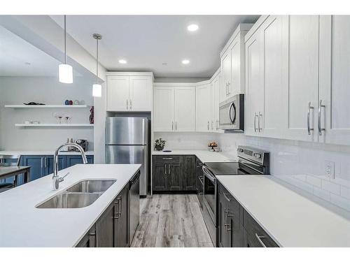 217 Lucas Crescent Nw, Calgary, AB - Indoor Photo Showing Kitchen With Stainless Steel Kitchen With Double Sink With Upgraded Kitchen