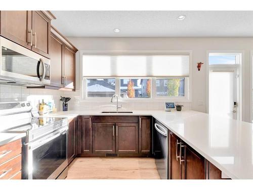 333 Clydesdale Way, Cochrane, AB - Indoor Photo Showing Kitchen With Upgraded Kitchen