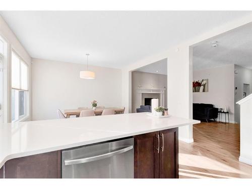 333 Clydesdale Way, Cochrane, AB - Indoor Photo Showing Kitchen With Fireplace