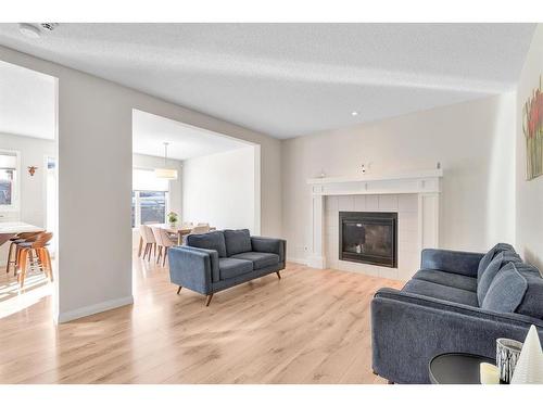 333 Clydesdale Way, Cochrane, AB - Indoor Photo Showing Living Room With Fireplace