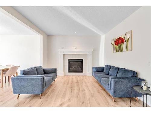 333 Clydesdale Way, Cochrane, AB - Indoor Photo Showing Living Room With Fireplace