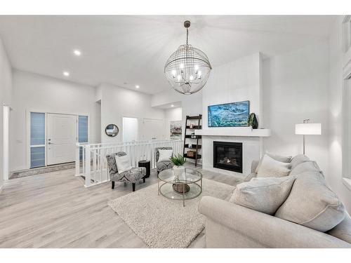 21 Cimarron Estates, Okotoks, AB - Indoor Photo Showing Living Room With Fireplace