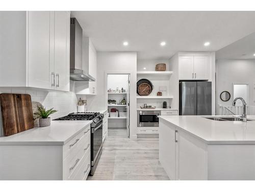 21 Cimarron Estates, Okotoks, AB - Indoor Photo Showing Kitchen With Stainless Steel Kitchen With Double Sink With Upgraded Kitchen