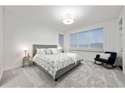 21 Cimarron Estates, Okotoks, AB - Indoor Photo Showing Bedroom