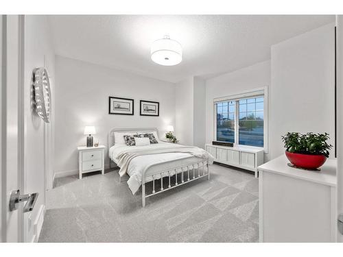 21 Cimarron Estates, Okotoks, AB - Indoor Photo Showing Bedroom