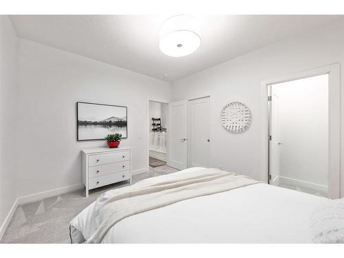 21 Cimarron Estates, Okotoks, AB - Indoor Photo Showing Bedroom