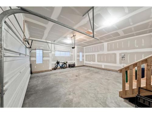 21 Cimarron Estates, Okotoks, AB - Indoor Photo Showing Garage