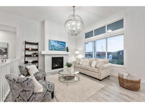 21 Cimarron Estates, Okotoks, AB - Indoor Photo Showing Living Room With Fireplace