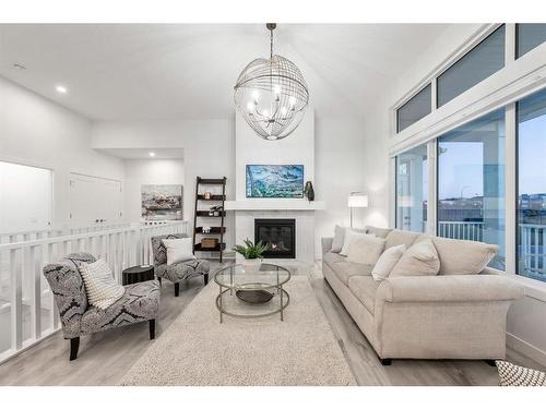 21 Cimarron Estates, Okotoks, AB - Indoor Photo Showing Living Room With Fireplace