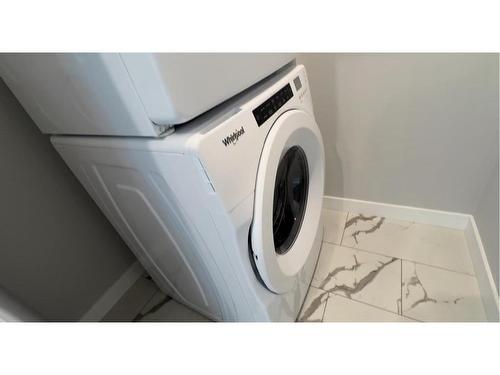 4213-111 Wolf Creek Drive Se, Calgary, AB - Indoor Photo Showing Laundry Room