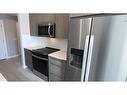 4213-111 Wolf Creek Drive Se, Calgary, AB  - Indoor Photo Showing Kitchen 