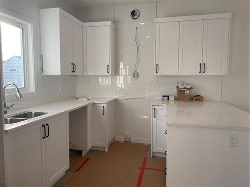 148 Lawson Lane Se, Airdrie, AB - Indoor Photo Showing Kitchen With Double Sink