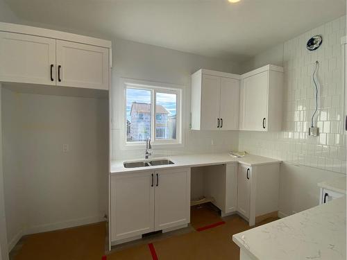 148 Lawson Lane Se, Airdrie, AB - Indoor Photo Showing Kitchen With Double Sink