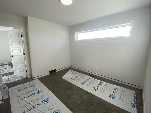 148 Lawson Lane Se, Airdrie, AB - Indoor Photo Showing Other Room