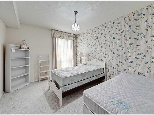 7 Coleridge Crescent Nw, Calgary, AB - Indoor Photo Showing Bedroom