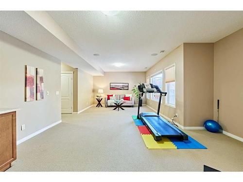 105 Aspen Stone Road Sw, Calgary, AB - Indoor Photo Showing Gym Room