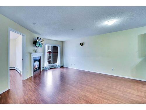 310-290 Shawville Way Se, Calgary, AB - Indoor With Fireplace