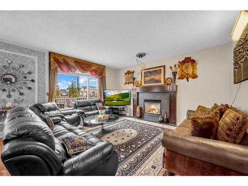 6 Copperstone Close Se, Calgary, AB - Indoor Photo Showing Living Room With Fireplace