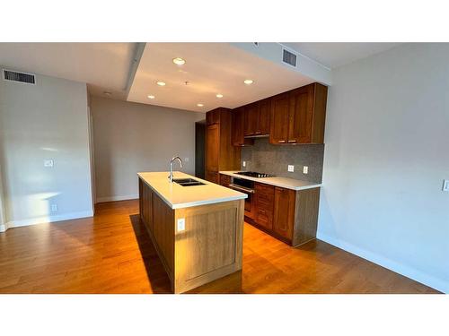 1615-222 Riverfront Avenue Sw, Calgary, AB - Indoor Photo Showing Kitchen With Double Sink