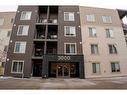 3205-403 Mackenzie Way Sw, Airdrie, AB  - Outdoor With Balcony With Facade 