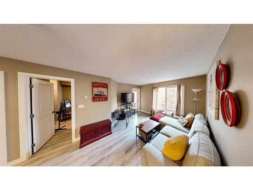 3205-403 Mackenzie Way Sw, Airdrie, AB - Indoor Photo Showing Living Room