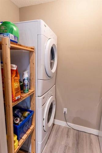 3205-403 Mackenzie Way Sw, Airdrie, AB - Indoor Photo Showing Laundry Room