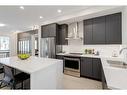 235 South Shore Court, Chestermere, AB  - Indoor Photo Showing Kitchen With Stainless Steel Kitchen With Double Sink With Upgraded Kitchen 