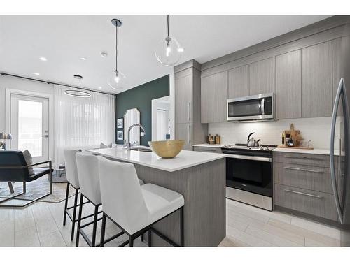 3106-111 Wolf Creek Drive Se, Calgary, AB - Indoor Photo Showing Kitchen With Stainless Steel Kitchen With Upgraded Kitchen