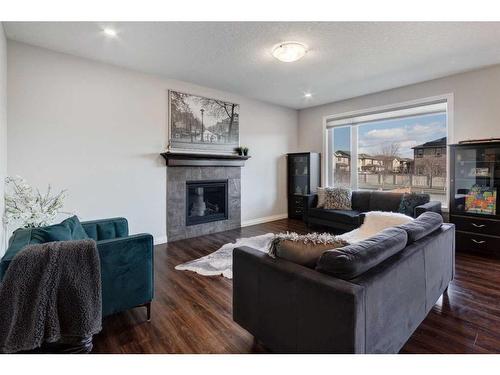 616 Reynolds Crescent Sw, Airdrie, AB - Indoor Photo Showing Living Room With Fireplace