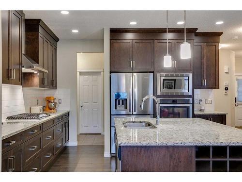 26 Mount Rae Terrace, Okotoks, AB - Indoor Photo Showing Kitchen With Stainless Steel Kitchen With Upgraded Kitchen