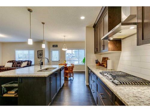 26 Mount Rae Terrace, Okotoks, AB - Indoor Photo Showing Kitchen With Double Sink With Upgraded Kitchen