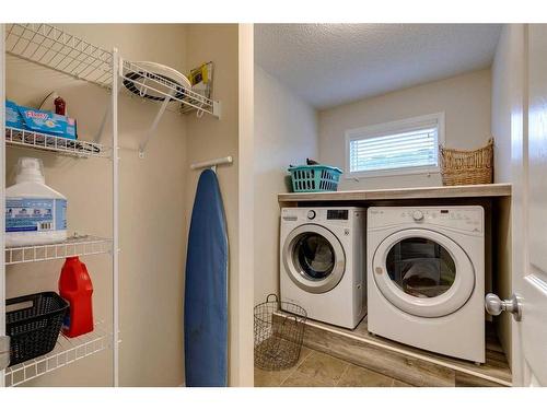 26 Mount Rae Terrace, Okotoks, AB - Indoor Photo Showing Laundry Room