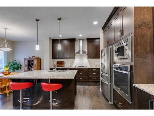 26 Mount Rae Terrace, Okotoks, AB - Indoor Photo Showing Kitchen With Stainless Steel Kitchen With Upgraded Kitchen