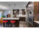 26 Mount Rae Terrace, Okotoks, AB  - Indoor Photo Showing Kitchen With Stainless Steel Kitchen With Upgraded Kitchen 