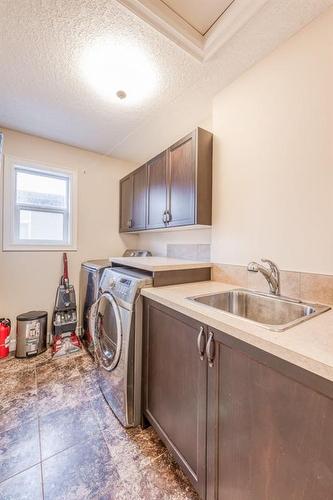 14 Aspen Acres Link Sw, Calgary, AB - Indoor Photo Showing Laundry Room