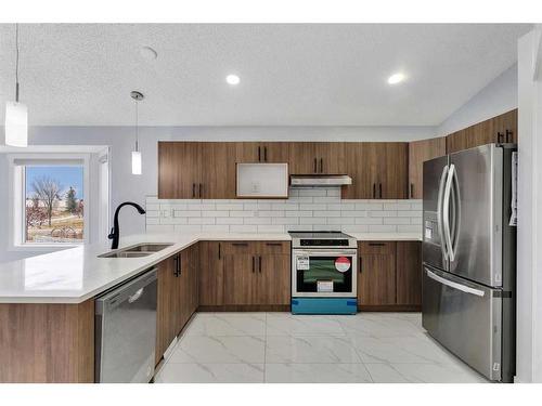 176 Stonegate Crescent Nw, Airdrie, AB - Indoor Photo Showing Kitchen With Stainless Steel Kitchen With Double Sink