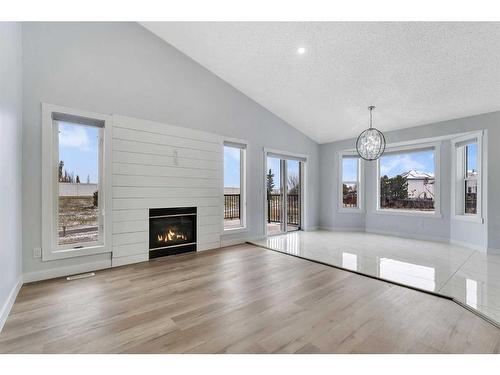 176 Stonegate Crescent Nw, Airdrie, AB - Indoor Photo Showing Living Room With Fireplace