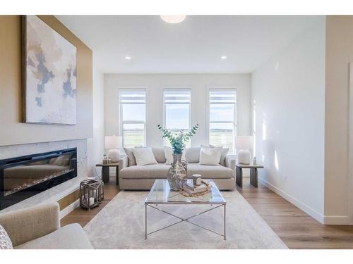 268 Belvedere Drive Se, Calgary, AB - Indoor Photo Showing Living Room With Fireplace