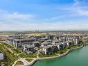 101-17 Mahogany Circle Se, Calgary, AB  - Outdoor With Body Of Water With View 