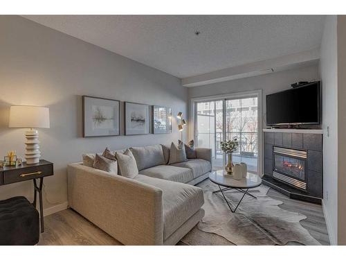 206-1800 14A Street Sw, Calgary, AB - Indoor Photo Showing Living Room With Fireplace