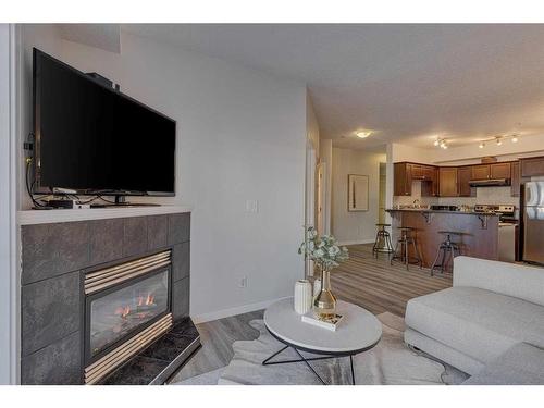 206-1800 14A Street Sw, Calgary, AB - Indoor Photo Showing Living Room With Fireplace