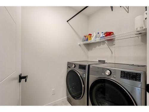 120 Seton Villas Se, Calgary, AB - Indoor Photo Showing Laundry Room