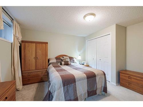 113 Tuscany Way Nw, Calgary, AB - Indoor Photo Showing Bedroom