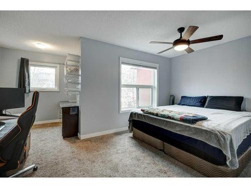 9-7 Westland Road, Okotoks, AB - Indoor Photo Showing Bedroom