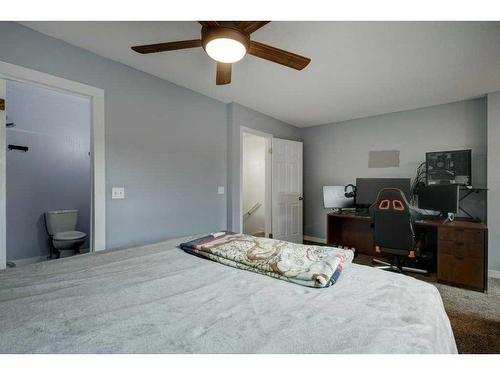 9-7 Westland Road, Okotoks, AB - Indoor Photo Showing Bedroom