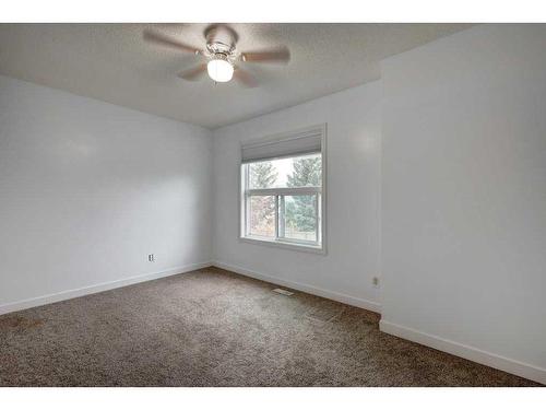 9-7 Westland Road, Okotoks, AB - Indoor Photo Showing Other Room