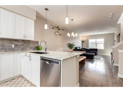 260 Midyard Lane Sw, Airdrie, AB - Indoor Photo Showing Kitchen With Upgraded Kitchen